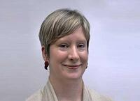 Head shot of Alison FitzGerald, a smiling woman with short blond hair