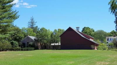 Colored photo of the main Library buildings from the west