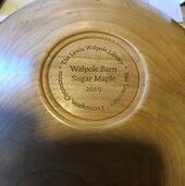 bottom of wooden bowl with inscription