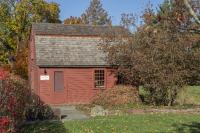 color photo of the Day Museum, a small red 18th century house